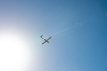 Airplane fly in a blue sky. Copy space for text.