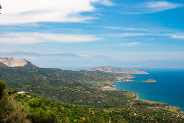 Fototapeta na wymiar Beautiful view of the Mirabello bay. Near to Sitia and Agios Nikolaos. Landscape with turquoise sea, mountains and green nature.