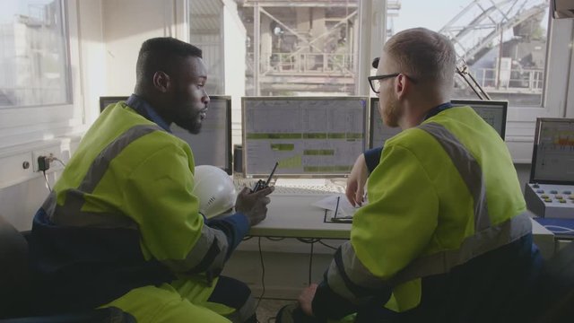 Industrial workers discussing work