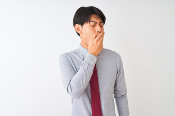 Chinese businessman wearing elegant tie standing over isolated white background bored yawning tired covering mouth with hand. Restless and sleepiness.
