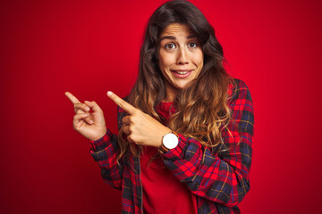 Young beautiful woman wearing casual jacket standing over red isolated background relaxed and smiling with eyes closed doing meditation gesture with fingers. Yoga concept.