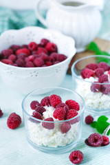 Cottage cheese with fresh raspberry for healthy breakfast