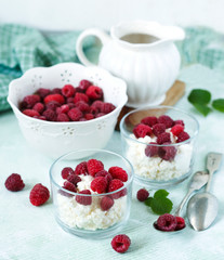 Cottage cheese with fresh raspberry for healthy breakfast