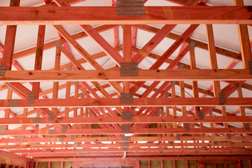 Treated timber framing, roof bracing and weatherproofing paper in a new house being built in New...