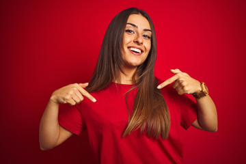Young beautiful woman wearing t-shirt standing over isolated red background looking confident with...