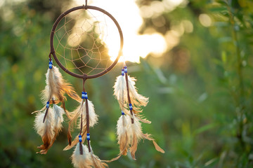 Dreamcatcher at sunset with copy space, symbol, tradition, signs. boho style