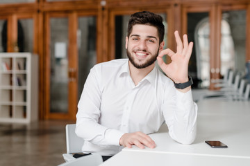 man showing positive gesture with hands