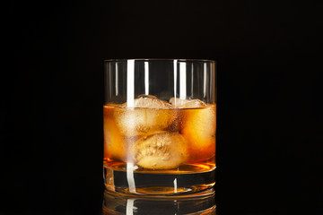 Whiskey highball on the black background, copy space