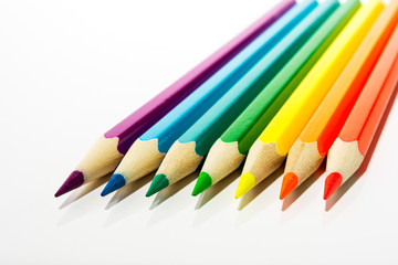 Fototapeta premium Kid's colored pencils as a symbol of first steps of artist