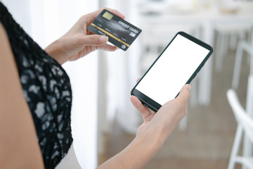 Mockup image of Beautiful woman shopping online with smartphone on online websites, mockup concept