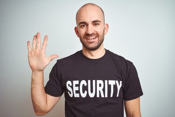 Young safeguard man wearing security uniform over isolated background showing and pointing up with...