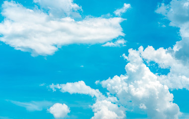 Fototapeta na wymiar Beautiful blue sky and white cumulus clouds abstract background. Cloudscape background. Blue sky and fluffy white clouds on sunny day. Nature weather. Bright day sky for happy day background.