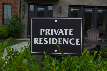 Fototapeta na wymiar Private residence Black sign on modern house background.