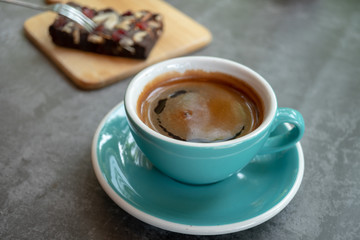 cup of coffee on wooden table