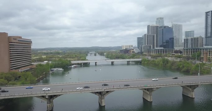 Aerial view of river in Austin, TX. flying thru bridges.