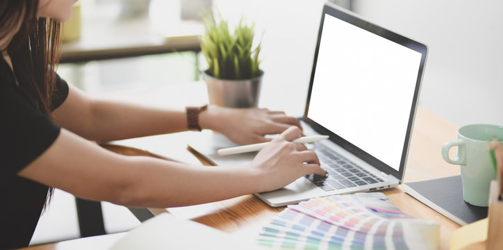 Cropped view of female graphic designer working on colour swatches