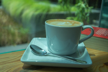 The latte art coffee with milk foam pattern