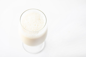 Glass of milk soy on white background. Image on top view.