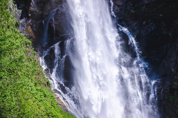 Misty Waterfall Spray on Rocks Close Up