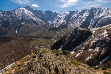 View from the mountain to the Georgian villages of Gergeti and Stepantsminda