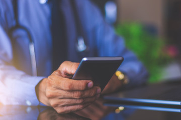 Smart male using mobile phone in office.