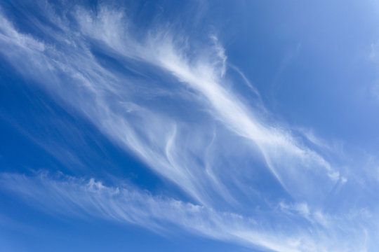 Cirrus clouds in a blue sky on a sunny day.