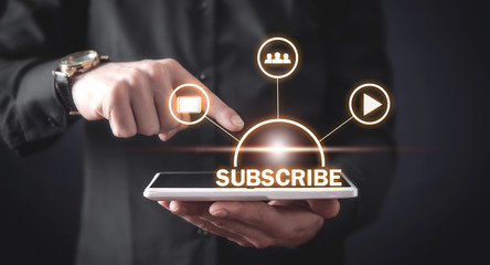 Man using digital tablet. Subscribe concept