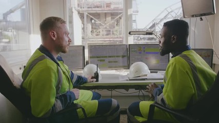 Two engineers talking to each other