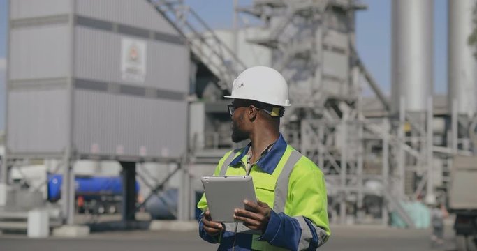 African foreman with tablet