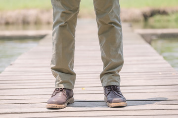 Model wearing sofe green color cargo pants or cargo trousers