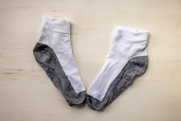 used socks on wood background
