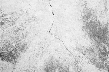 Texture of a concrete wall with cracks and scratches which can be used as a background