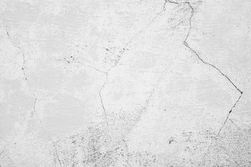 Texture of a concrete wall with cracks and scratches which can be used as a background