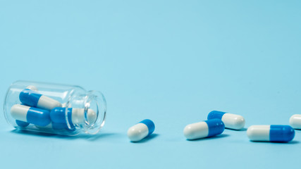 Studio shot of medical pills on blue background