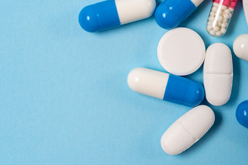 Studio shot of medical pills on blue background