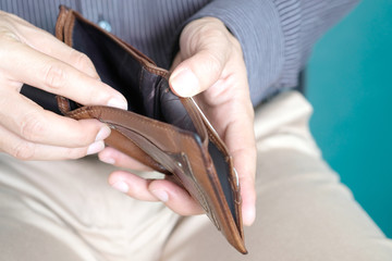 hand of businessman open pocket, no money in the business wallet, Financial concepts and expenditures,
