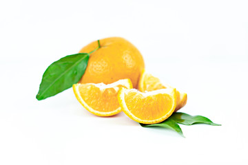 Orange fruits with leaf on isolated white background.