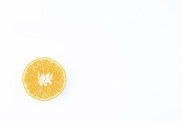 Orange fruits sliced with copy space on isolated white background.