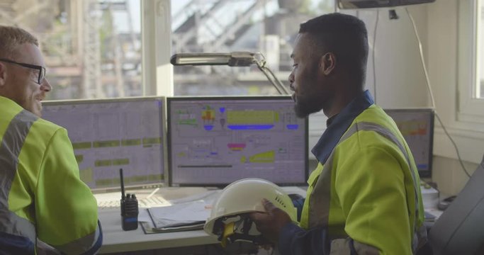 Engineers working in control room