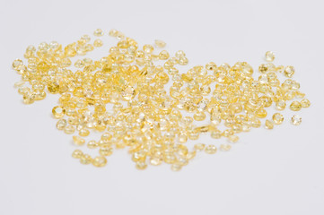 Group of little faceted yellow sapphires.