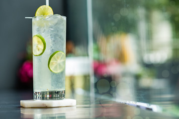 Sparkling lemon soda juice in glass served in restaurant
