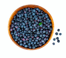 fresh blueberries in a wooden bowl