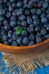 fresh blueberries in a wooden bowl
