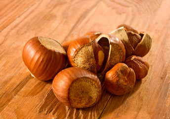 Isolated image of hazelnuts on a wooden surface closeup