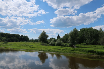 Fototapeta na wymiar Picturesque river, fields and forest landscape. Russia