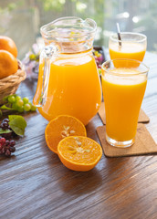 fresh orange on wooden background.