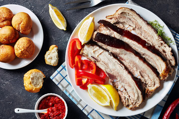 slices of roast pork belly on a white plate
