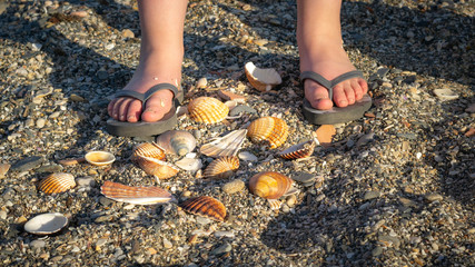 kids summer sandals on the beach.Summer holiday.