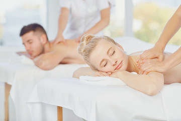 Couple enjoying massage at the spa center