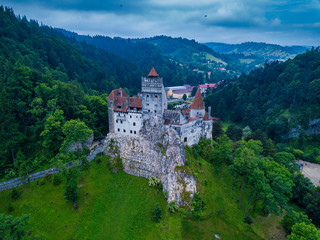 Fototapeta na wymiar Aerial panorama view of the medieval Bran Castle, known for the myth of Dracula , Dracula Castle in Brasov, Transylvania. Romania.